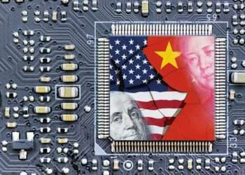 The Chinese and US flags overlaying microchips.
