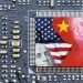 The Chinese and US flags overlaying microchips.